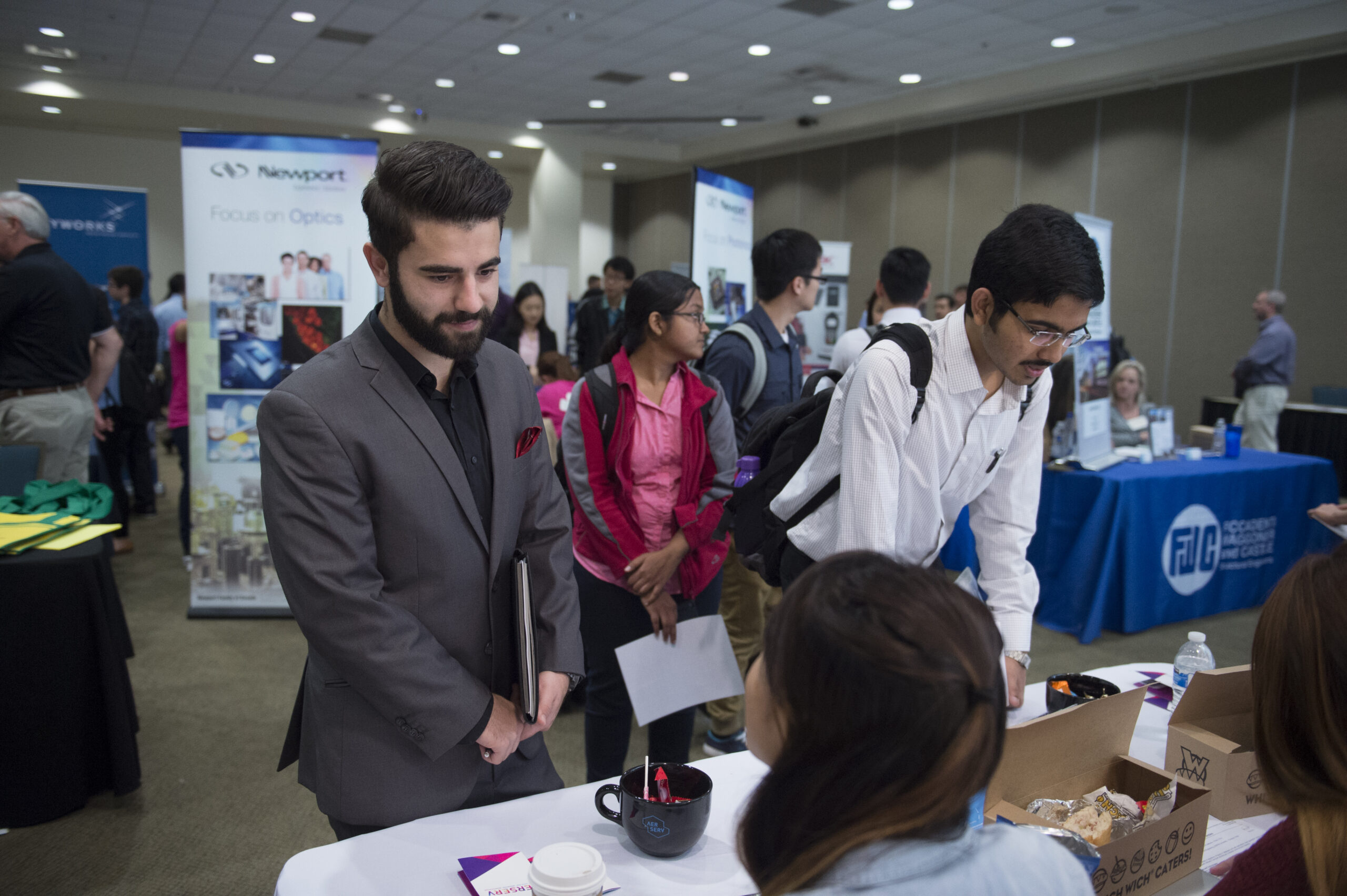Engineering Students talk to potential employers in the engineering field
